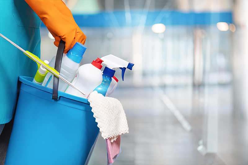 Housekeeping team cleaning a bright commercial interior