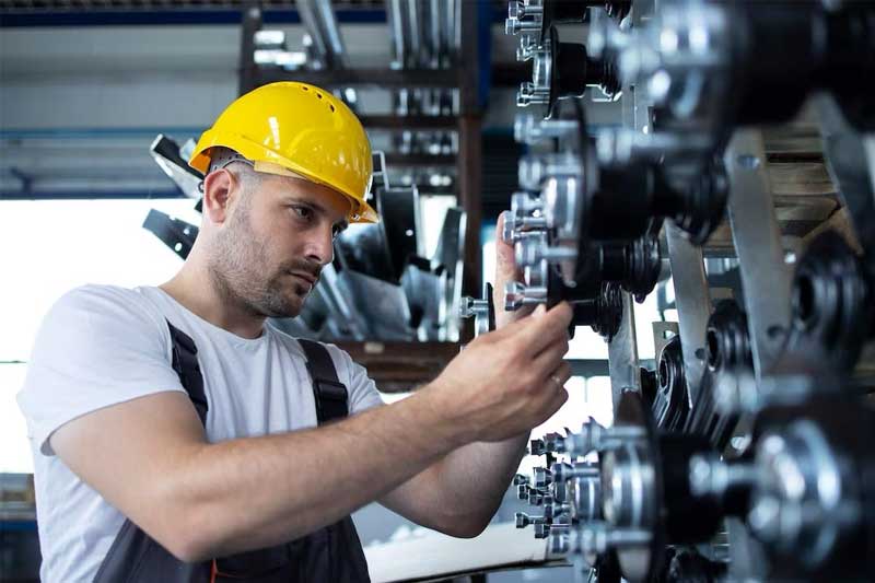 MEP technician working on building mechanical services